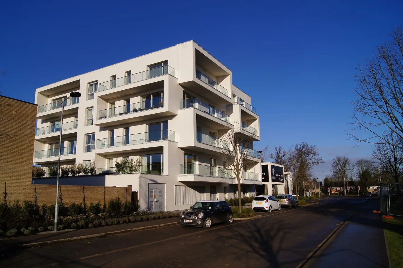 Flats at Clay Farm, Trumpington, part of the southern fringe growth already committed under the current plan. About 37,000 of the plan's 50,000 homes are of this kind: already permitted or allocated